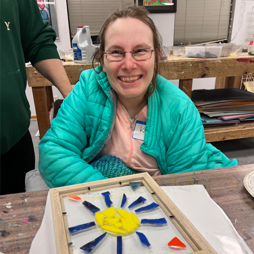  woman smiling with art project